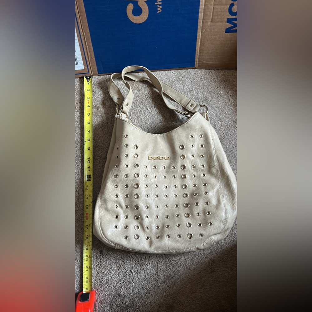 Bebe nude and gold colored shoulder purse